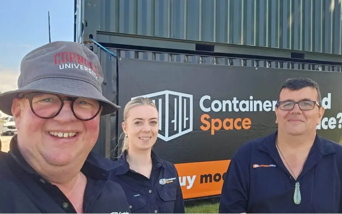 The Container Space team on site, next to a branded shipping container